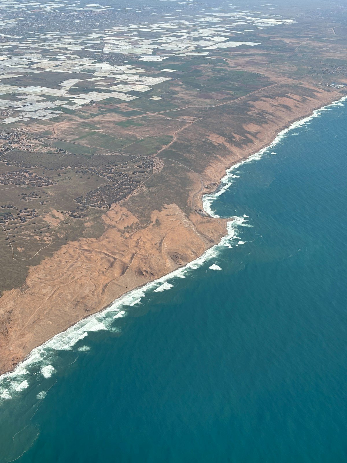 Aerial view of Agadir coastline with crashing Atlantic waves, Morocco