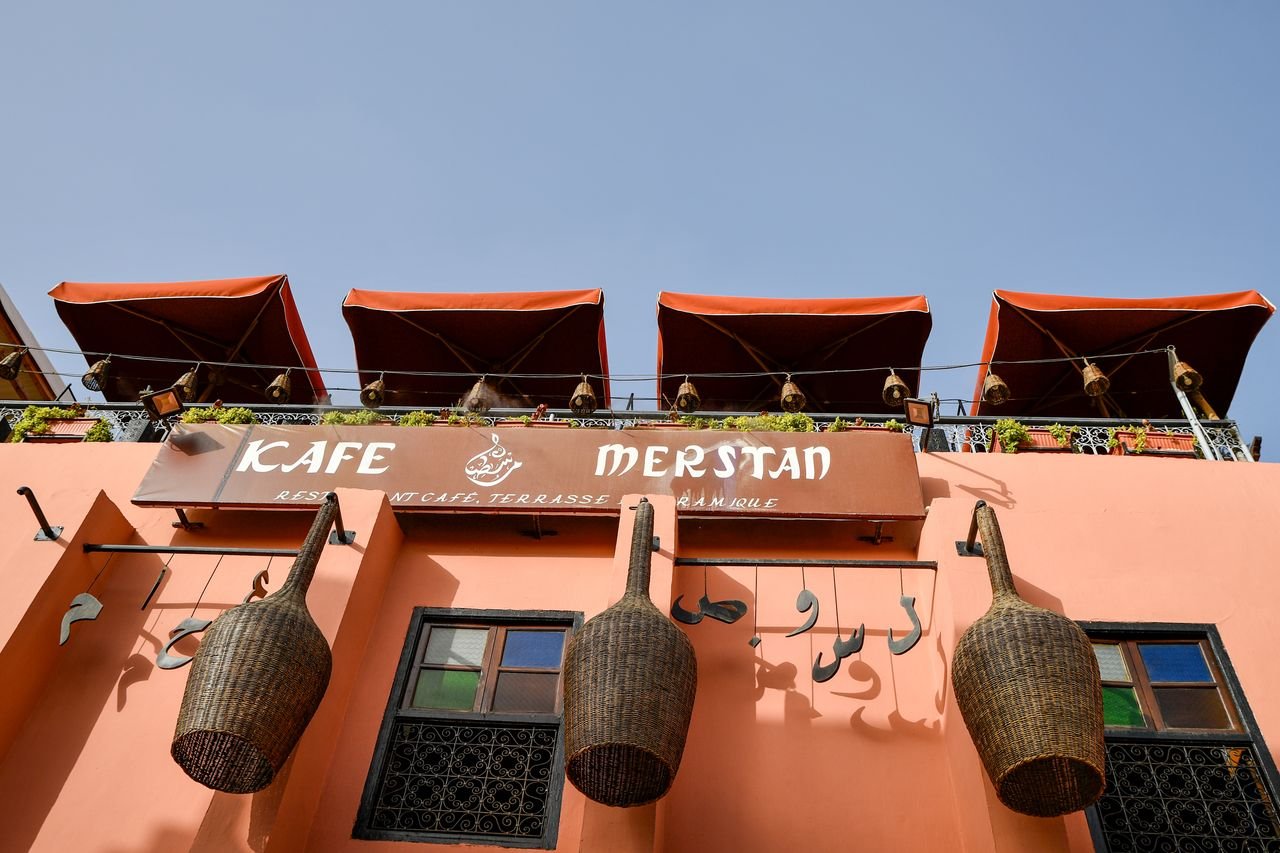 The ochre facade of a medina rooftop café