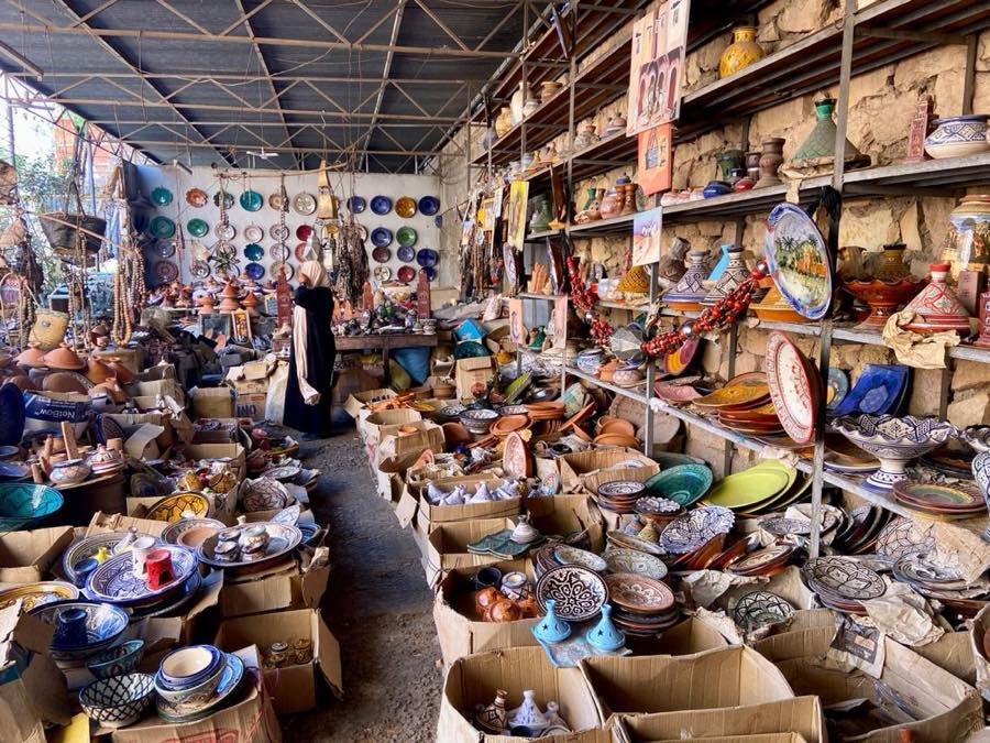 Hand-painted ceramics stacked in a souk shop