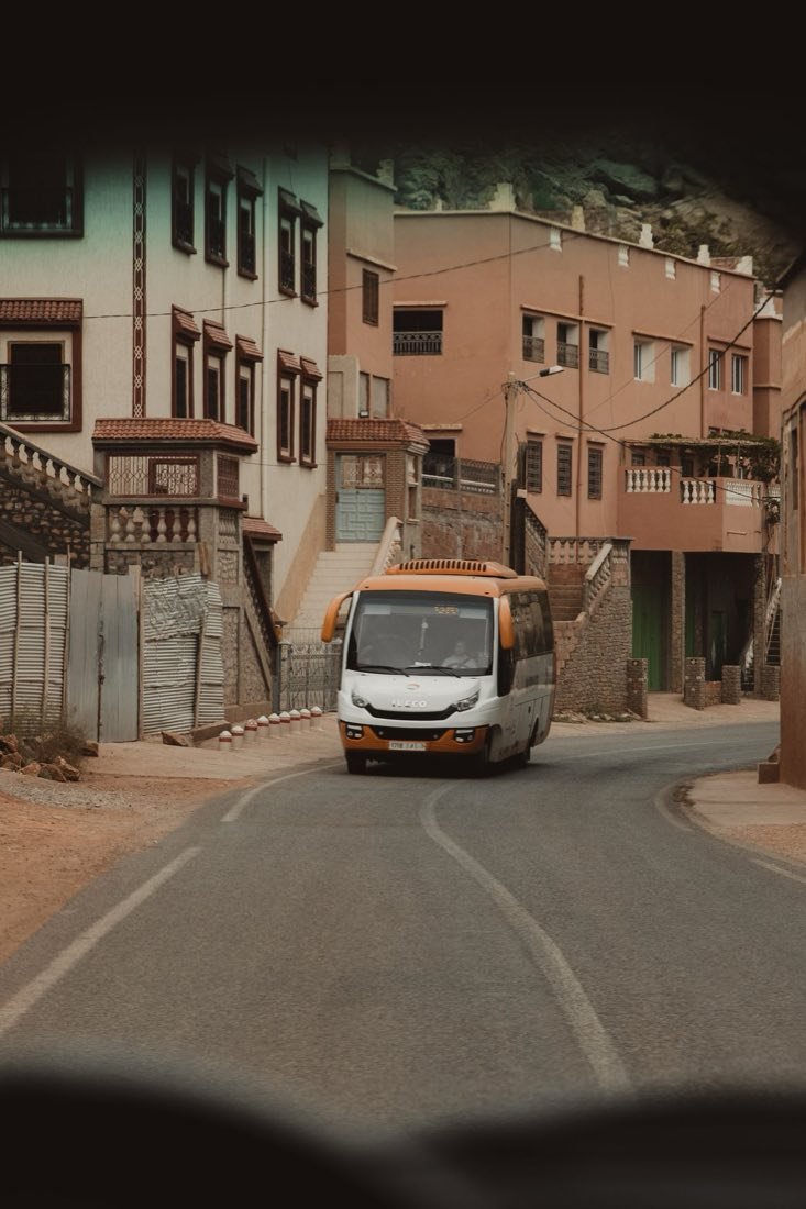 A minibus on a mountain village road