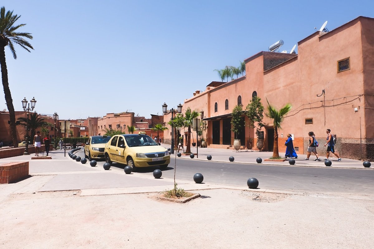 Yellow Moroccan taxis on a sunny street in Morocco