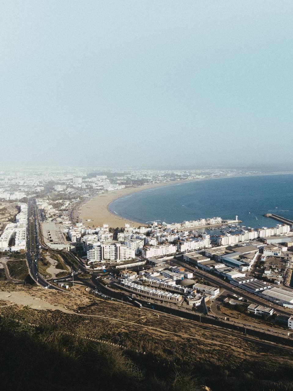 Aerial view of Agadir bay, beach and marina, the nearest city with emergency hospitals to Taghazout