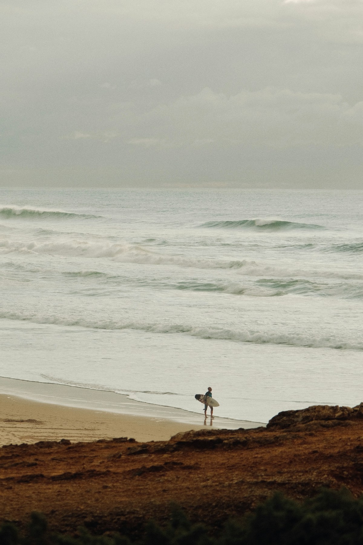 Surfer heading to the Atlantic, Morocco
