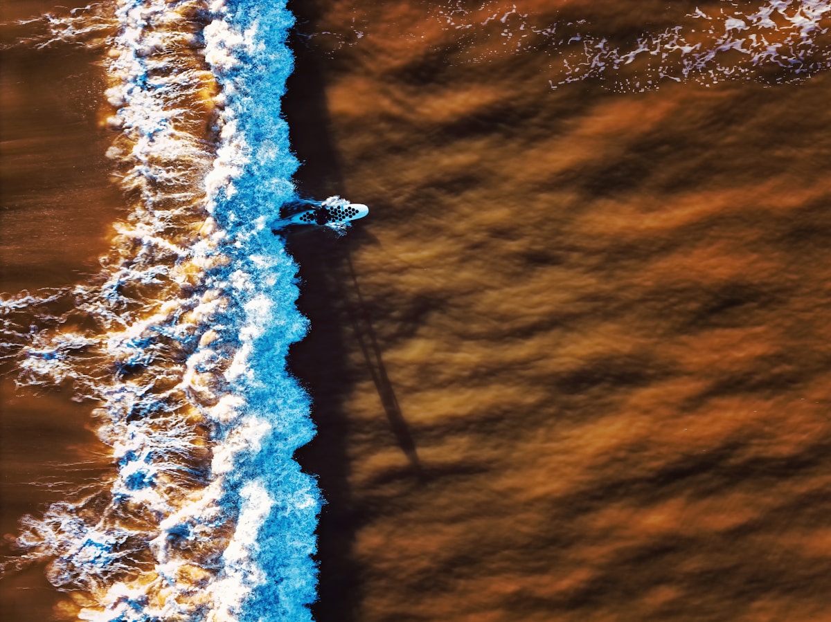 Surfer riding a powerful wave at Anchor Point, Morocco