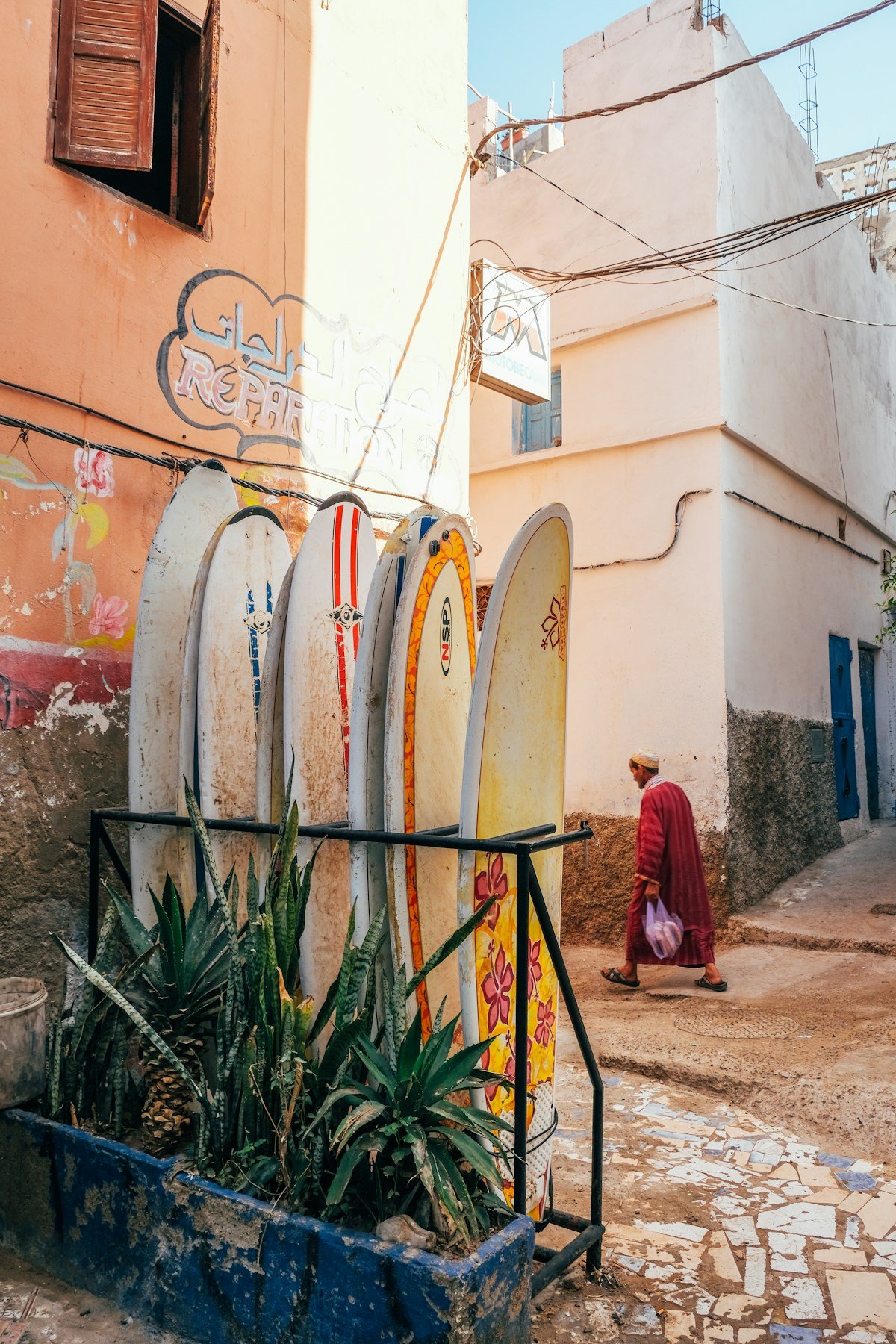 Surfboards leaning against a building in Taghazout, Morocco