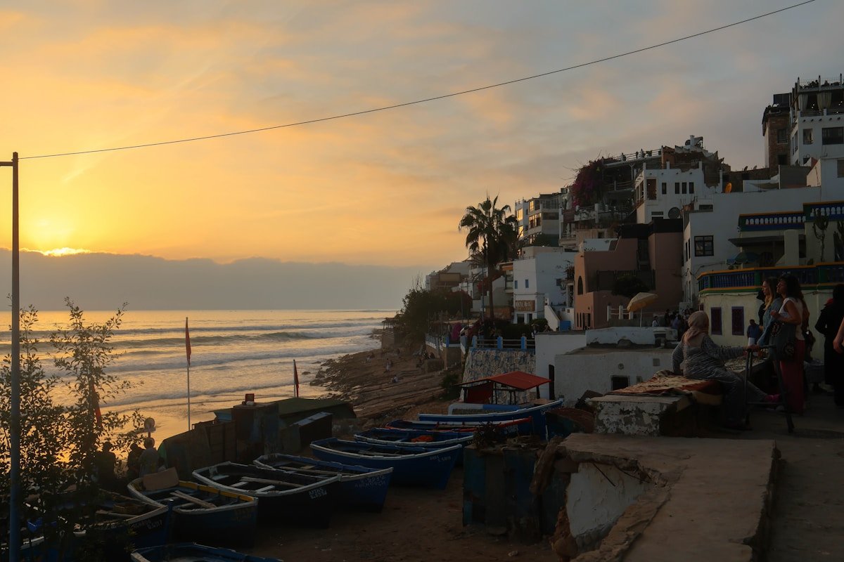 Taghazout coastal village at sunset with boats in August