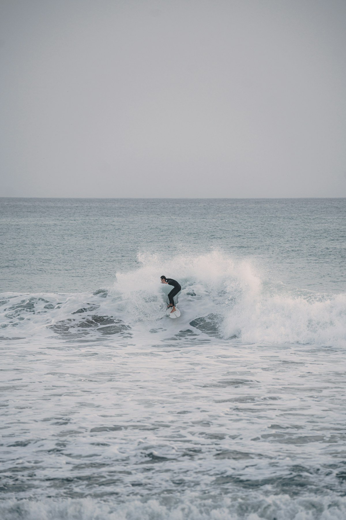 Surfer riding a wave at Anchor Point, Taghazout Morocco in December