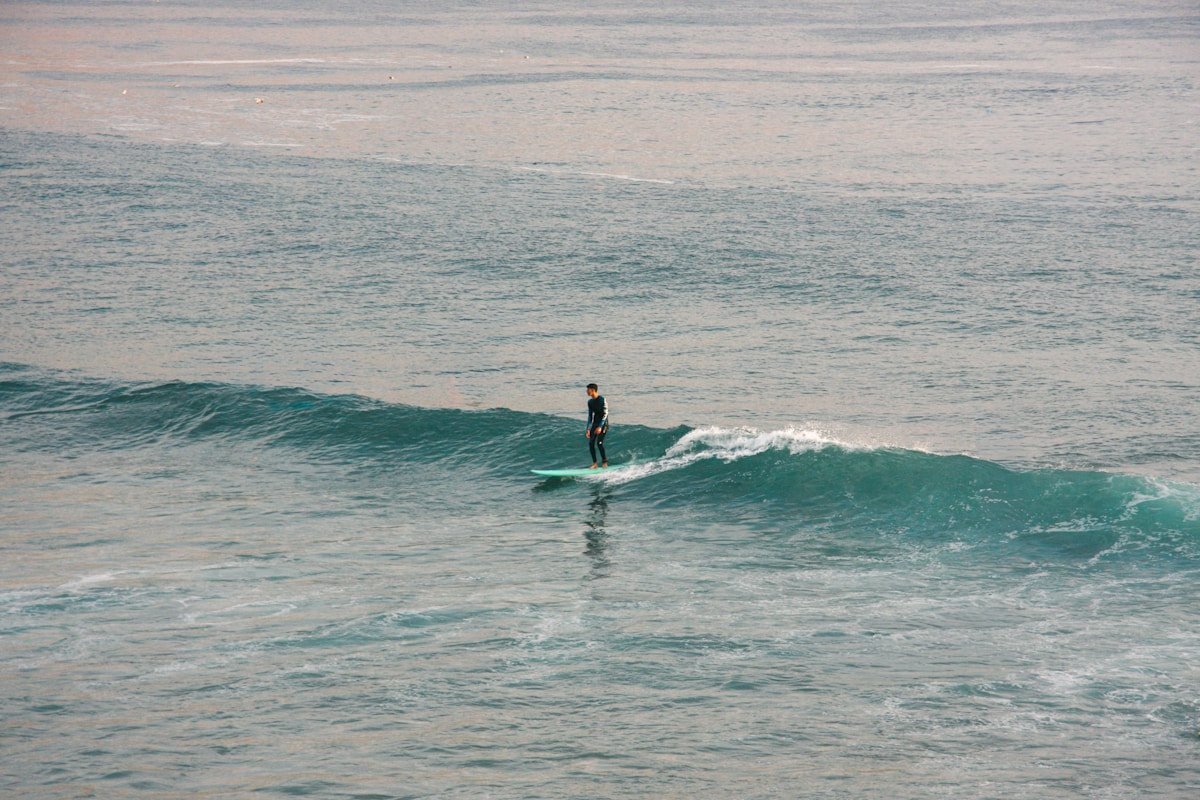 Surfer riding a wave at Imsouane, Morocco in February