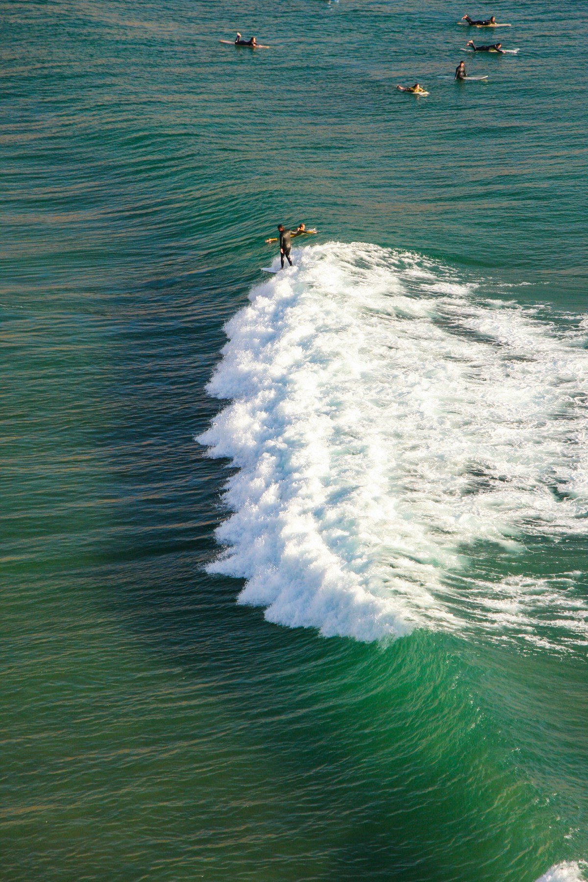 Surfers catching waves at Imsouane, Morocco in March