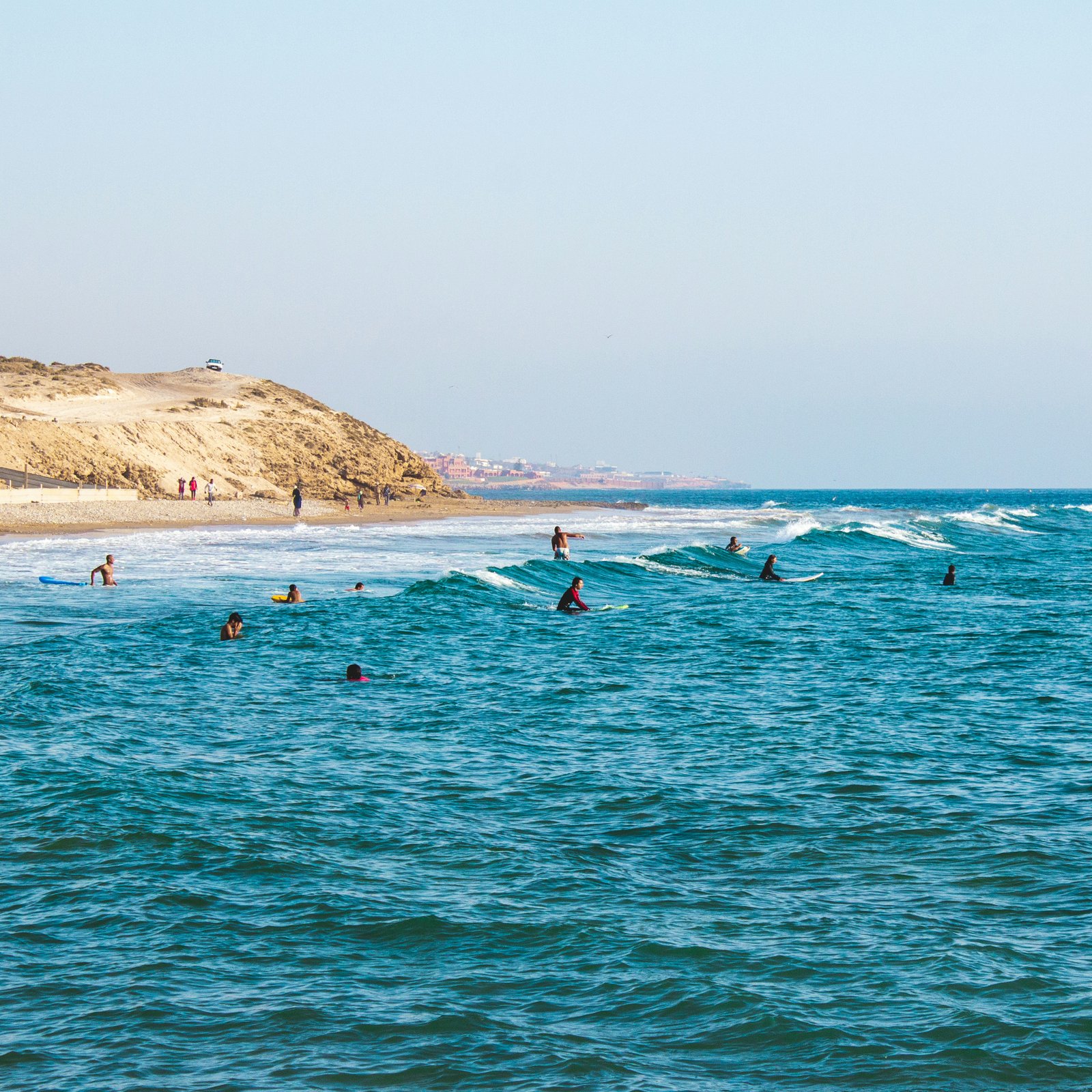 Surfers in the Atlantic ocean at Tamraght, Morocco