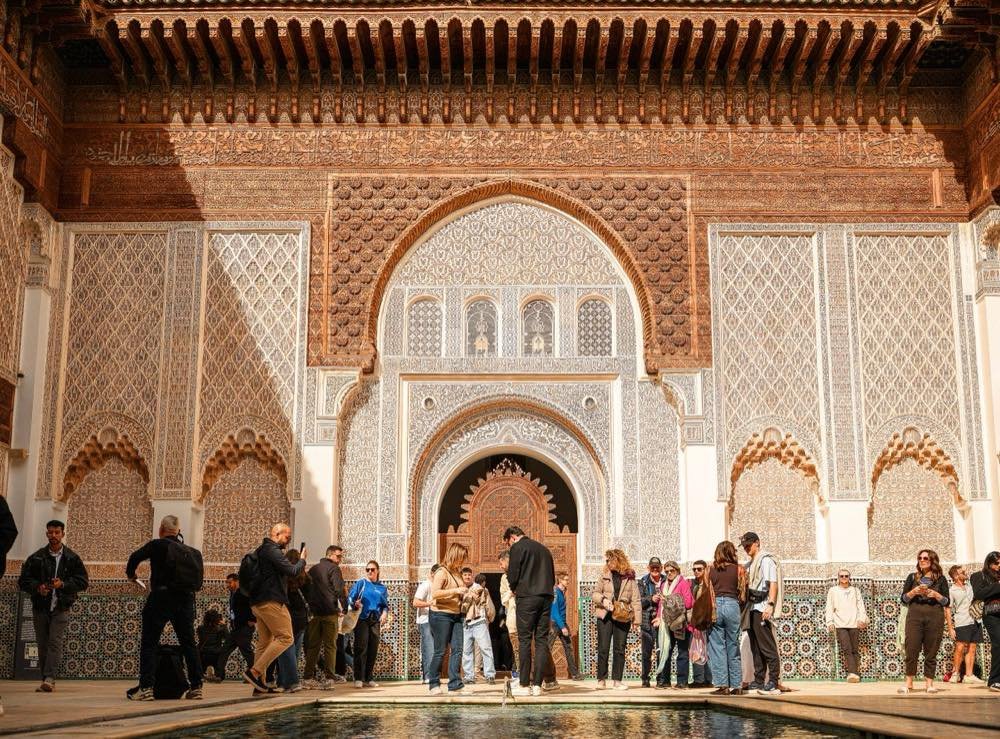 Visitors in the Ben Youssef Madrasa courtyard in Marrakech