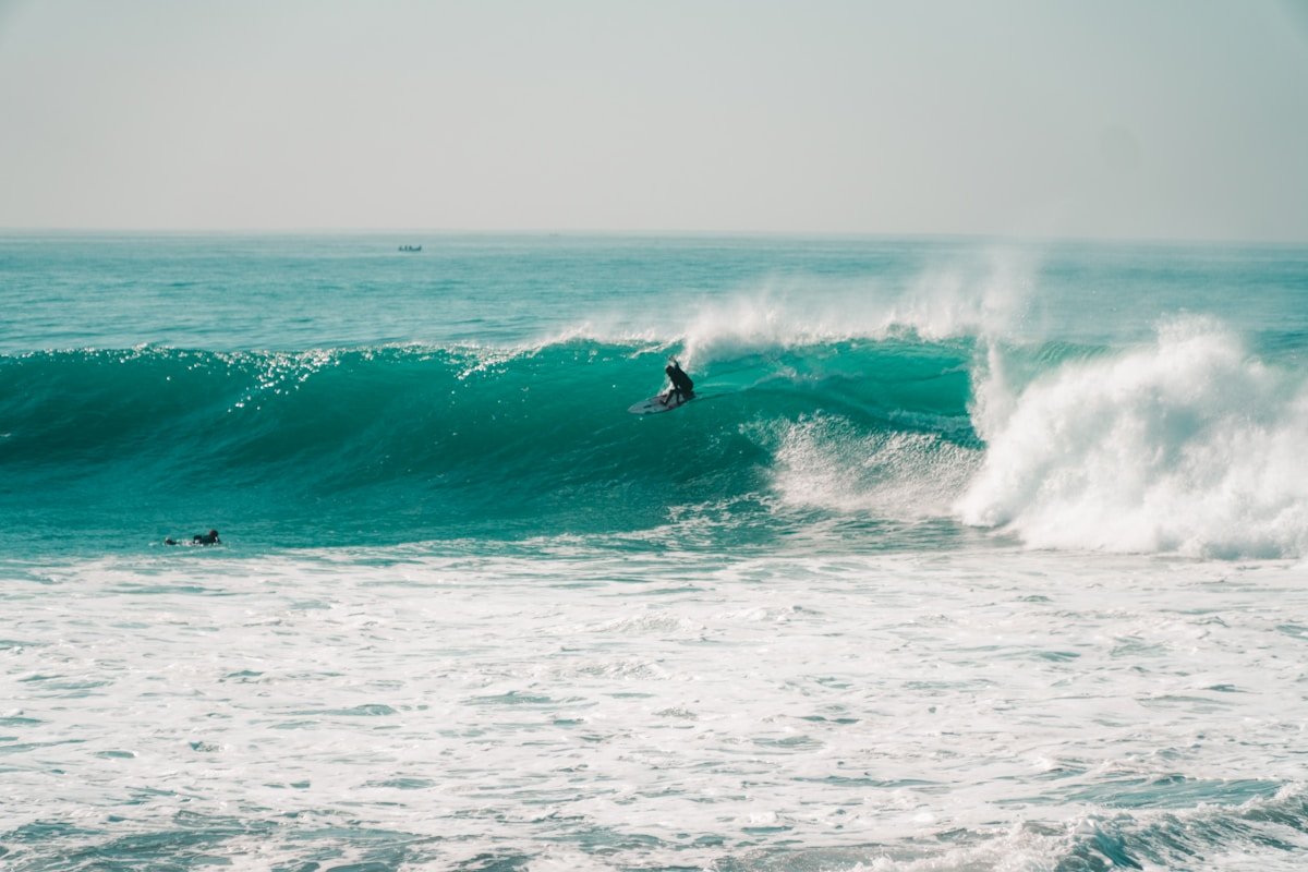 Surfer riding a wave at Anchor Point, Taghazout Morocco