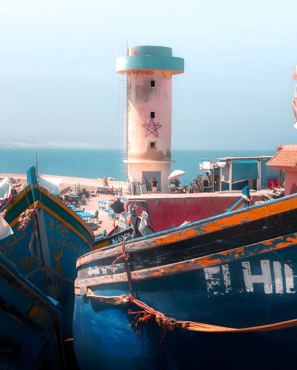 Imsouane harbour with fishing boats and coastal village, Morocco